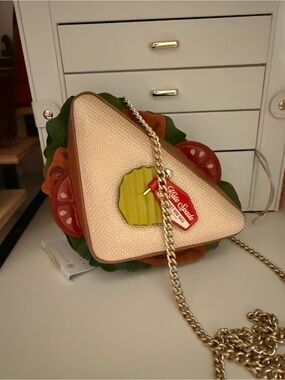 kate spade cream and pink sandwich-shaped crossbody with gold chain